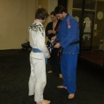 Tyler receiving his 1st stripe on his blue belt.