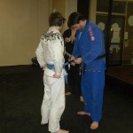 Tyler receiving his 1st stripe on his blue belt.